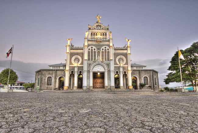 An exterior shot of the Cartago Cathedral in Costa Rica at dusk.